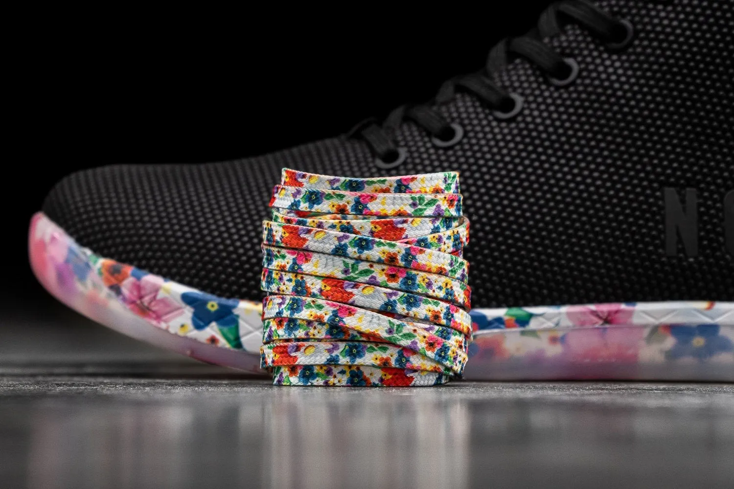 HIGH-TOP BLACK DAISY TRAINER (MEN'S)
